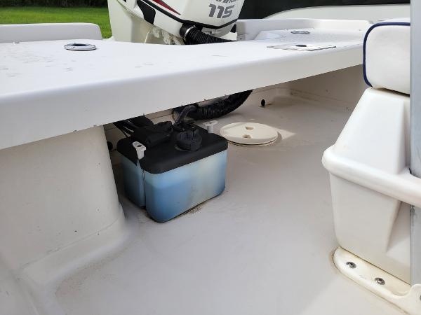 Slide: The Image of 2001 Pathfinder 1806V boat interior with motor and battery compartment. - 2