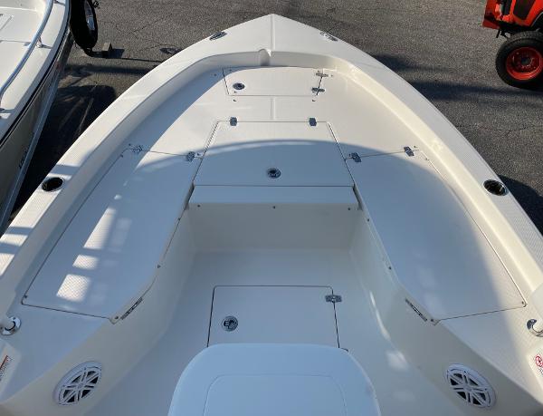 Slide: The Image of 2024 Pathfinder 2200 TRS boat interior with storage compartments and seating. - 12
