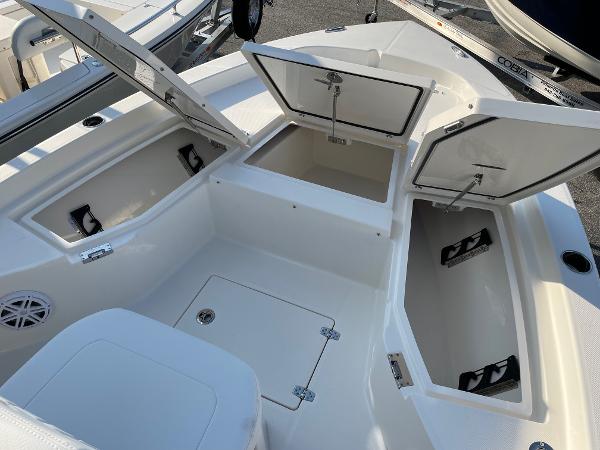 Slide: The Image of 2024 Pathfinder 2200 TRS boat with open storage compartments. - 13