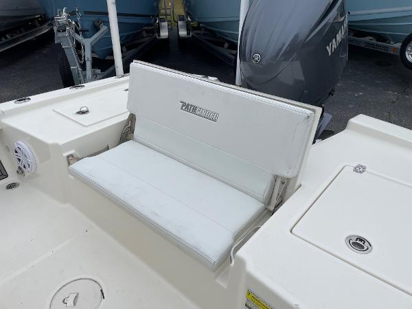 Slide: The Image of 2024 Pathfinder 2200 TRS boat with white seating and Yamaha outboard motor. - 16