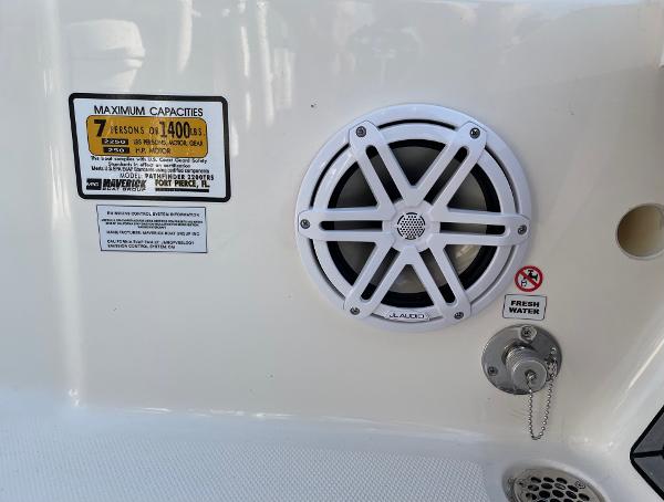 Slide: The Image of 2024 Pathfinder 2200 TRS boat speaker and capacity label. - 23