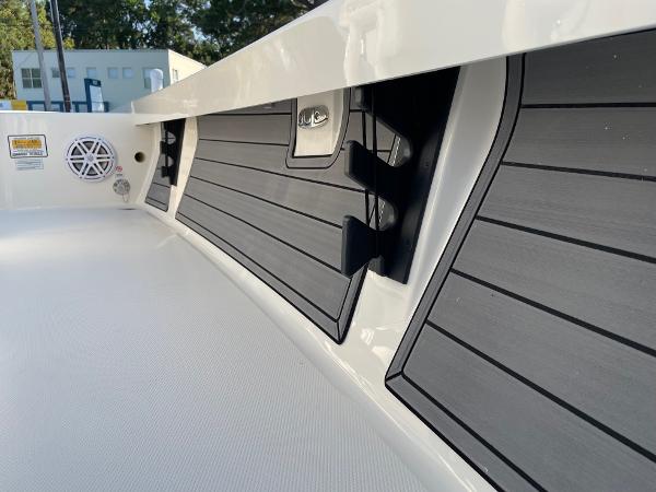 Slide: The Image of 2024 Pathfinder 2200 TRS boat interior with sleek black and white design. - 24
