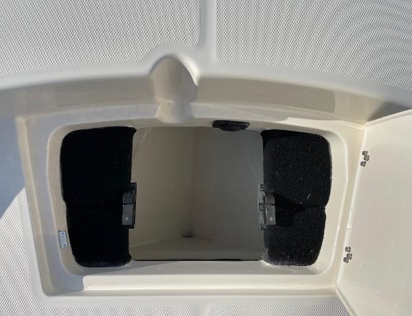 Slide: The Image of 2024 Pathfinder 2200 TRS boat storage compartment with open hatch. - 26