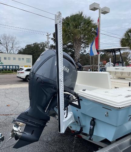 Slide: The Image of 2024 Pathfinder 2200 TRS boat with Yamaha outboard motor in a parking lot. - 3