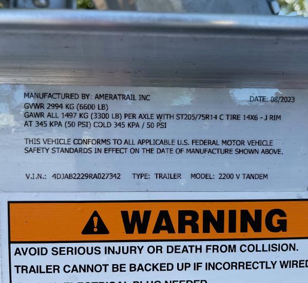 Slide: The Image of 2024 Pathfinder 2200 TRS trailer label with specifications and safety warning. - 30