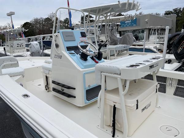 Slide: The Image of 2024 Pathfinder 2200 TRS boat interior with console and seating. - 5