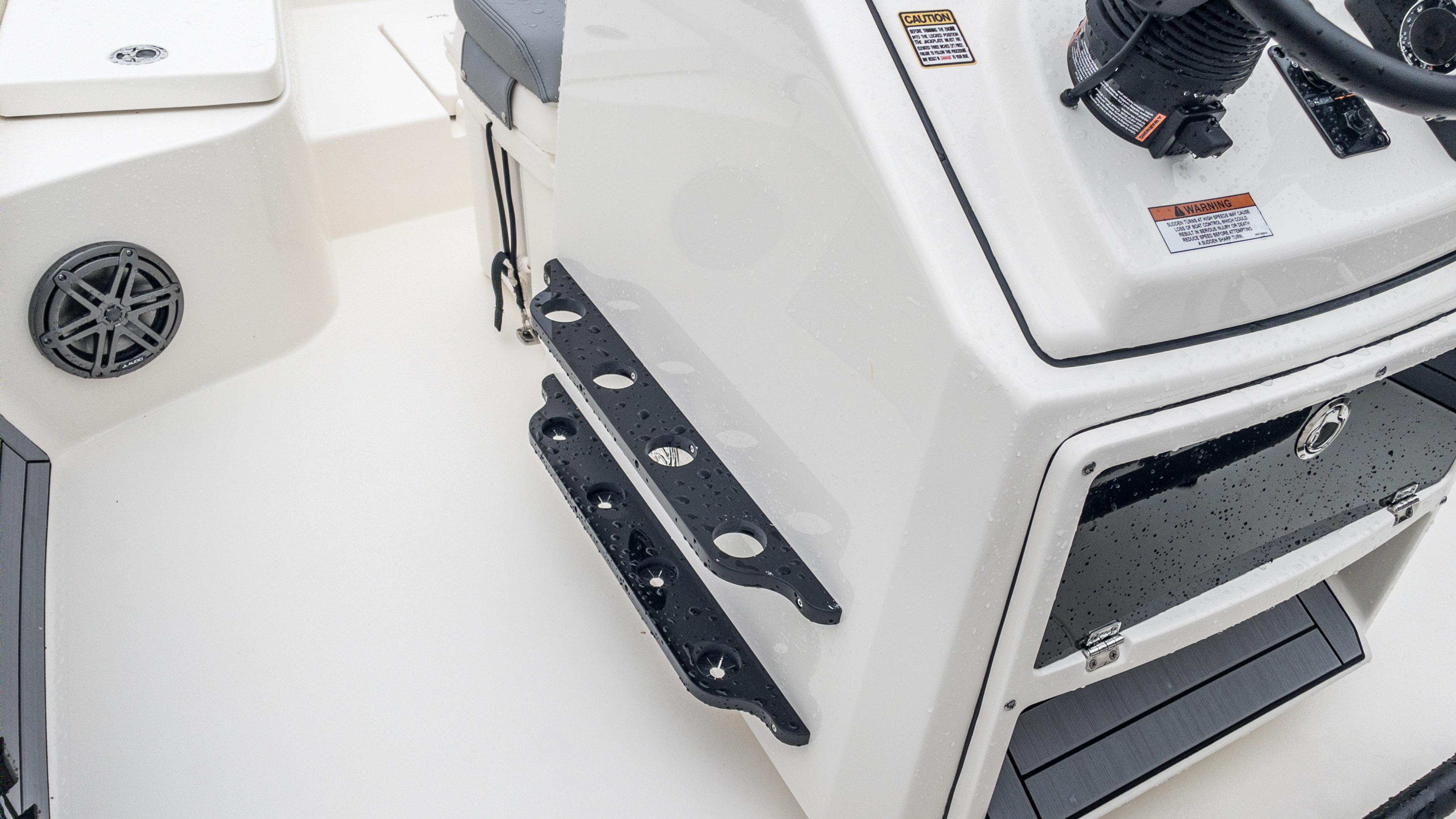 Slide: The Image of 2024 Pathfinder 2300 HPS boat console with rod holders and speaker. - 19
