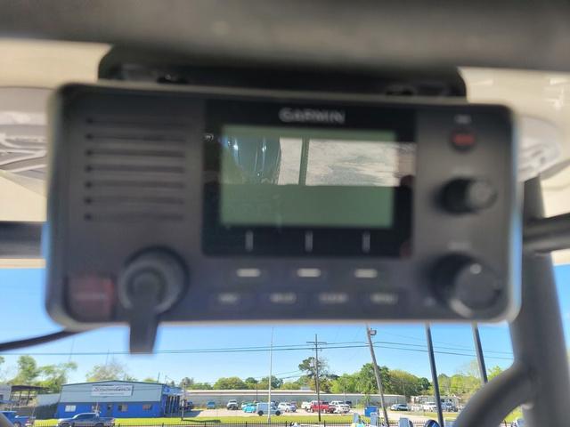 Slide: The Image of Garmin marine radio on 2023 Pathfinder 2400 Open boat dashboard. - 11