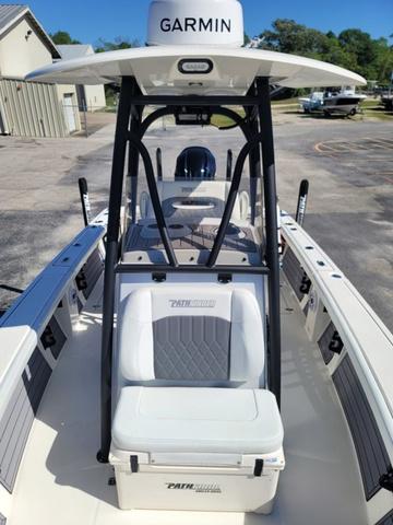 Slide: The Image of 2023 Pathfinder 2400 Open boat with Garmin equipment, docked outdoors. - 13