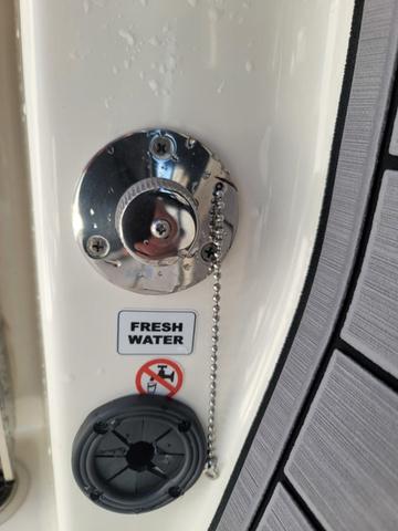 Slide: The Image of 2023 Pathfinder 2400 Open boat fresh water fill cap and speaker detail. - 16
