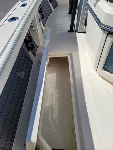 Slide: The Image of 2023 Pathfinder 2400 Open boat interior with open storage compartment. - 17
