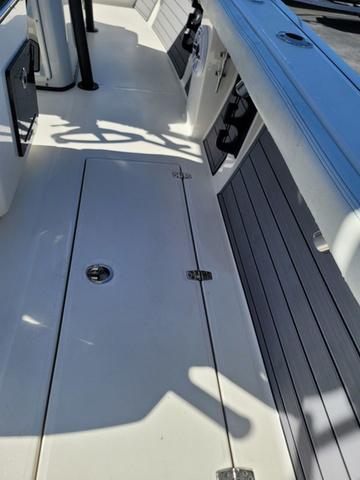Slide: The Image of 2023 Pathfinder 2400 Open boat deck with storage compartments. - 19