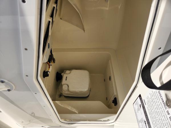 Slide: The Image of 2024 Pathfinder 2700 Open boat storage compartment with portable toilet. - 14