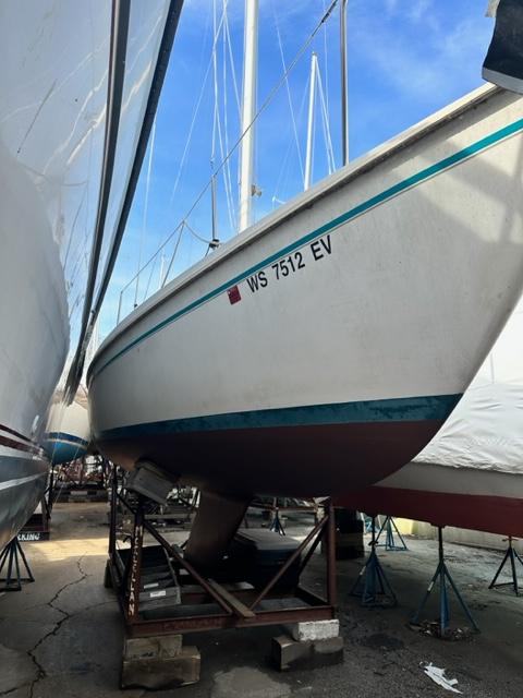 Slide: The Image of 1978 Pearson 26 sailboat on a stand, hull number WS 7512 EV. - 0
