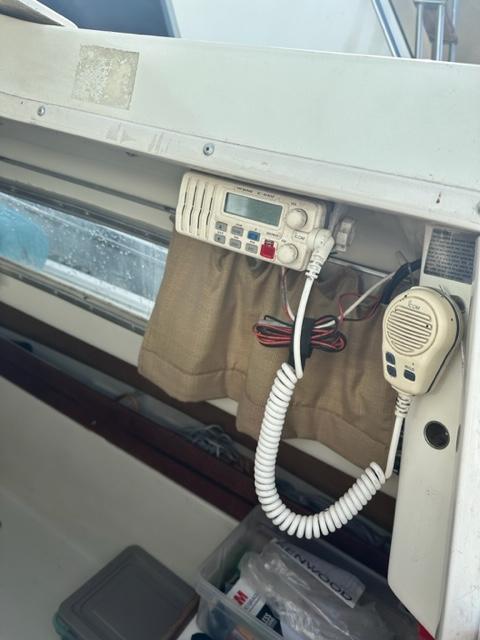 Slide: The Image of VHF radio and microphone installed on a 1978 Pearson 26 sailboat. - 12