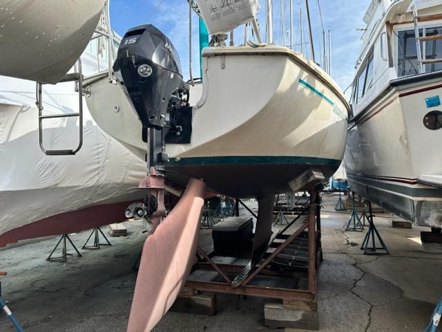 Slide: The Image of 1978 Pearson 26 sailboat on dry dock with outboard motor. - 2