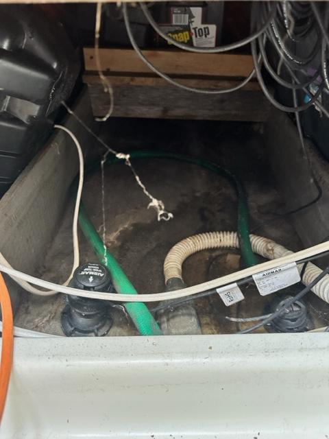 Slide: The Image of Bilge area of a 1978 Pearson 26 sailboat with hoses and wiring. - 22