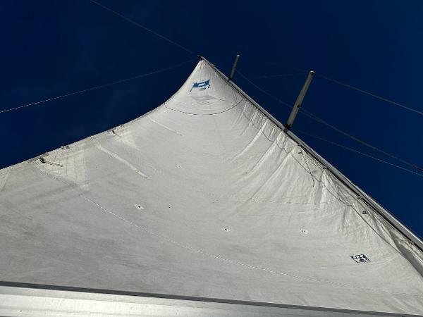 Slide: The Image of Close-up of a Pearson 31 sailboat's sail against a clear blue sky, 1989 model. - 12