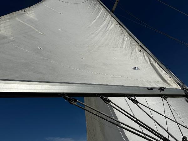 Slide: The Image of Close-up of sail on 1989 Pearson 31 sailboat against clear blue sky. - 13