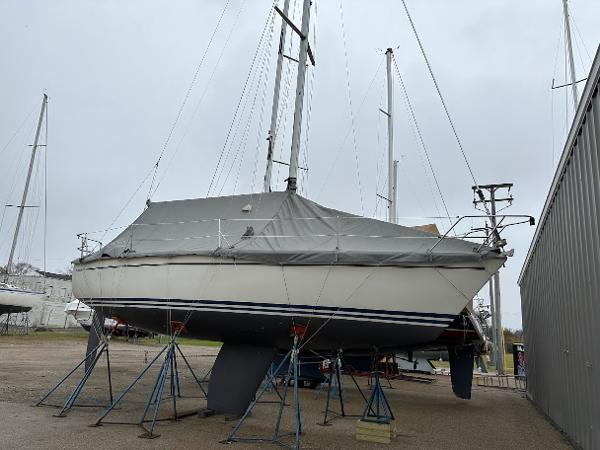 Slide: The Image of Pearson 31 sailboat, 1989 model, on stands for maintenance in a boatyard. - 15