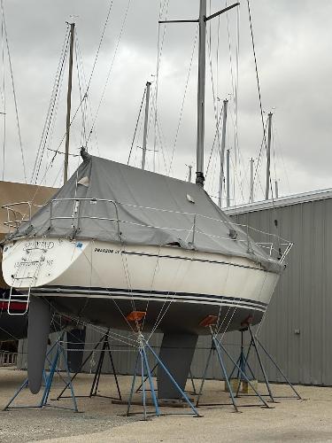 Slide: The Image of Pearson 31 sailboat, 1989 model, on stands in a boatyard. - 16