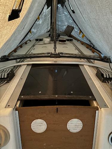 Slide: The Image of 1989 Pearson 31 sailboat cockpit under cover. - 17