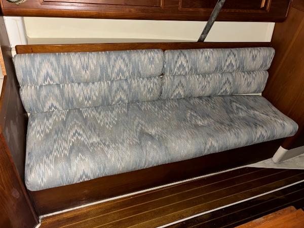 Slide: The Image of Blue patterned cushioned seating in 1989 Pearson 31 sailboat interior. - 24