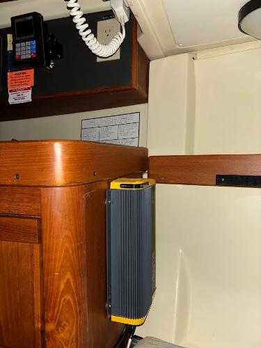 Slide: The Image of Interior of a 1989 Pearson 31 sailboat with navigation equipment and wooden cabinetry. - 26