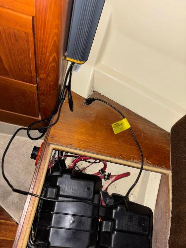 Slide: The Image of Battery compartment and wiring in a 1989 Pearson 31 sailboat. - 27
