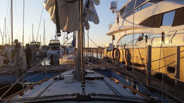 Slide: The Image of Pearson 31 sailboat docked at marina, 1989 model, sunset view. - 3