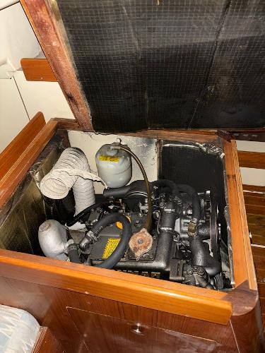 Slide: The Image of 1989 Pearson 31 sailboat engine compartment with open access panel. - 32