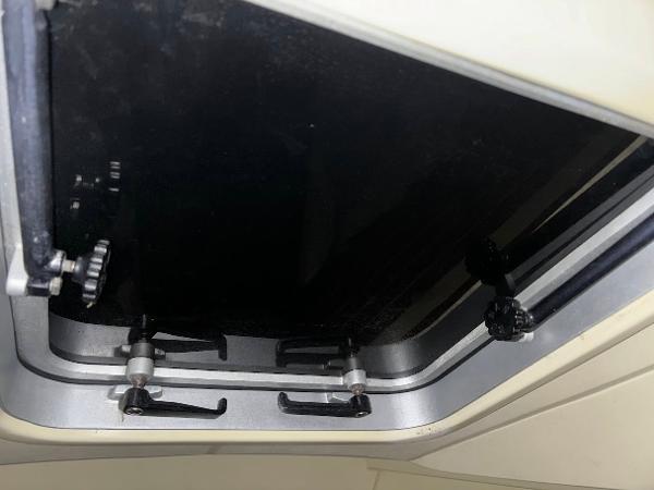 Slide: The Image of Pearson 31 1989 boat hatch with locking mechanisms. - 35