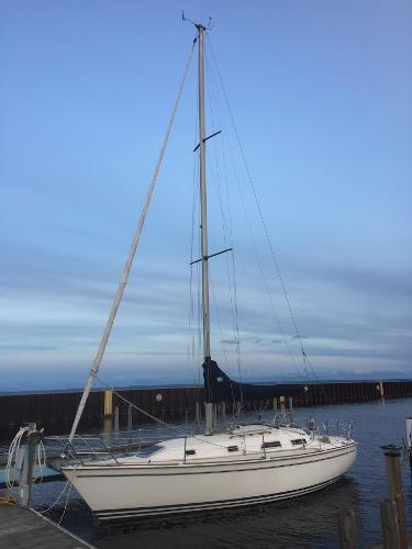 Slide: The Image of 1989 Pearson 31 sailboat docked at a marina. - 4