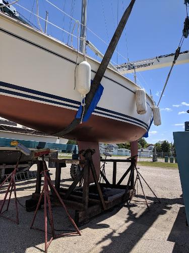 Slide: The Image of 1989 Pearson 31 sailboat on stands for maintenance. - 8