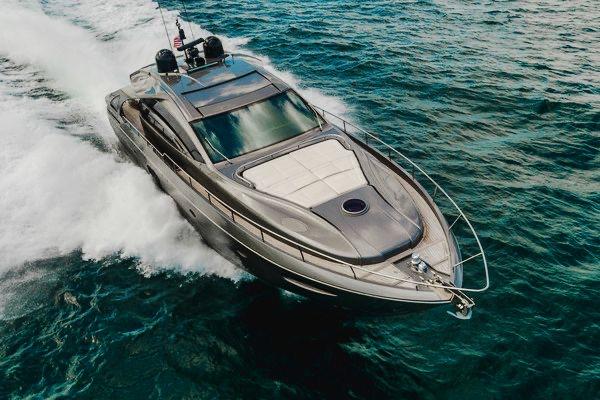 Slide: The Image of Luxury 2015 Pershing 70 yacht cruising on open water, showcasing sleek design and performance. - 15