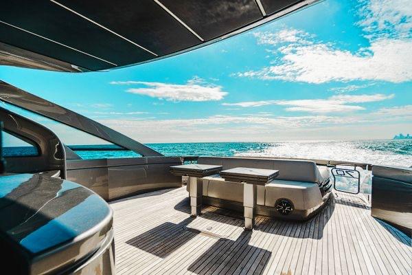Slide: The Image of Luxurious 2015 Pershing 70 yacht deck with ocean view and clear blue sky. - 31