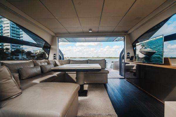 Slide: The Image of Luxurious interior of a 2015 Pershing 70 yacht with modern seating and scenic views. - 41