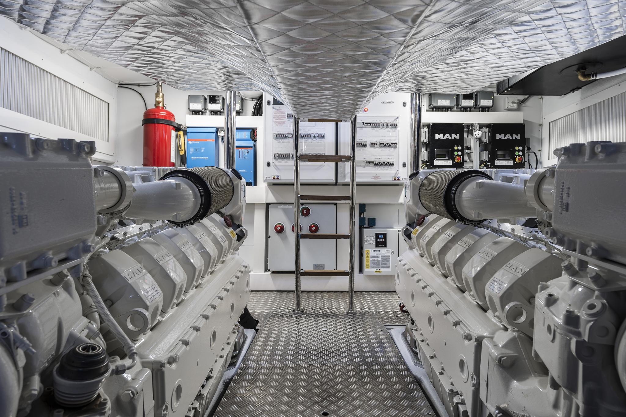 Slide: The Image of Engine room of 2025 Pershing 7X yacht with MAN engines and control panels. - 25