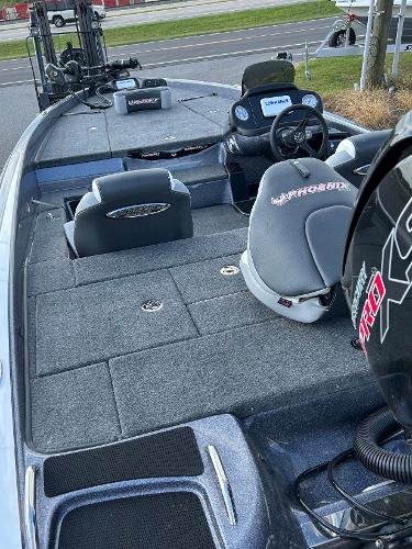 Slide: The Image of 2024 Phoenix 518 Pro fishing boat interior with seats and steering console. - 3
