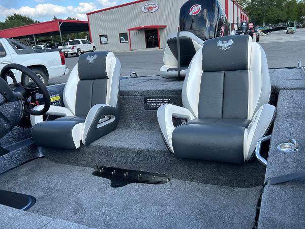 Slide: The Image of 2024 Phoenix 518 Pro boat interior with dual seats and steering wheel. - 4