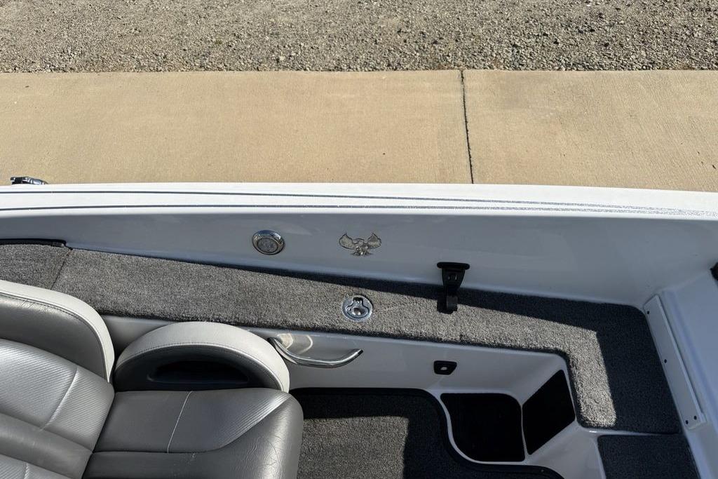 Slide: The Image of Interior of a 2019 Phoenix 618 Pro boat with gray seating and carpeted flooring. - 20