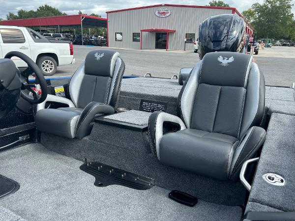 Slide: The Image of 2024 Phoenix 721 Pro XP boat interior with two black and gray seats. - 4