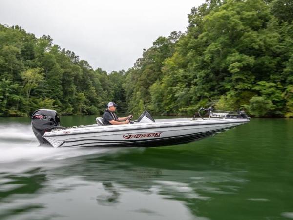 Slide: The Image of 2025 Phoenix 818 Pro boat speeding on a lush, green river. - 0