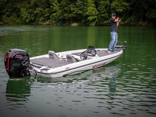 Slide: The Image of 2025 Phoenix 818 Pro fishing boat on a serene lake with an angler. - 6