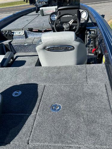Slide: The Image of 2024 Phoenix 819 Pro boat interior with steering console and storage compartments. - 4
