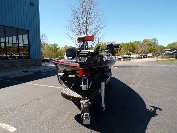 Slide: The Image of 2024 Phoenix 919 Pro XP boat on trailer in parking lot. - 10