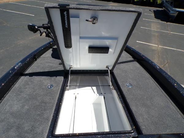 Slide: The Image of 2024 Phoenix 919 Pro XP boat storage compartment open, showing interior space. - 18