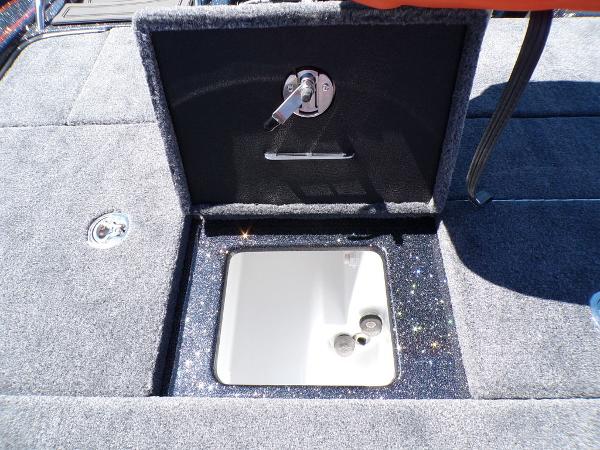 Slide: The Image of 2024 Phoenix 919 Pro XP boat storage compartment with open hatch. - 19