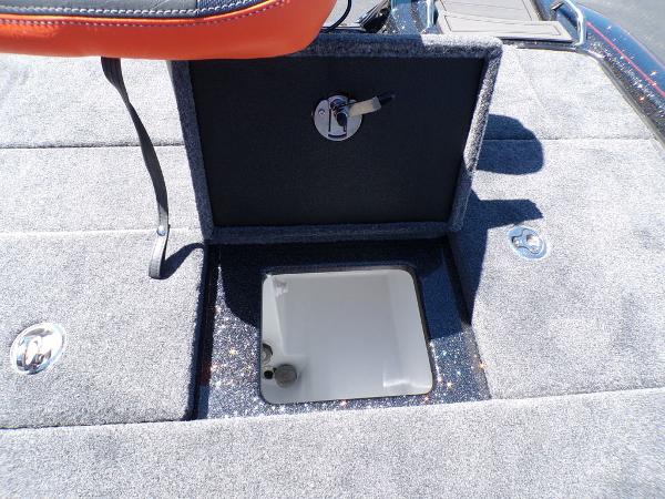 Slide: The Image of 2024 Phoenix 919 Pro XP boat storage compartment with open lid. - 20