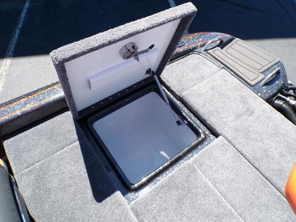 Slide: The Image of Open storage compartment on a 2024 Phoenix 919 Pro XP boat. - 21